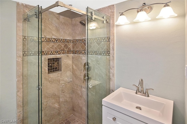 full bath with a shower stall and vanity