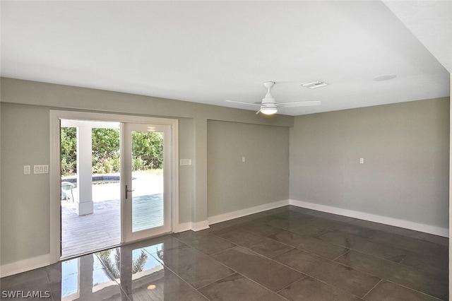 interior space with a ceiling fan, french doors, visible vents, and baseboards