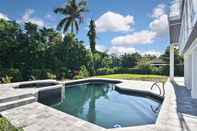 view of pool featuring a patio area