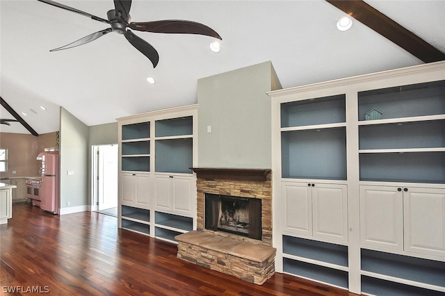 unfurnished living room with lofted ceiling with beams, ceiling fan, dark wood-type flooring, a fireplace, and recessed lighting