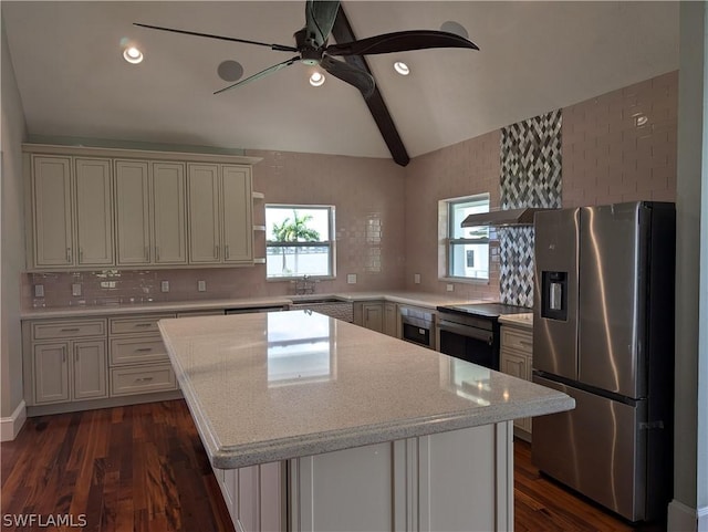 kitchen featuring lofted ceiling with beams, a center island, black electric range, and stainless steel fridge with ice dispenser