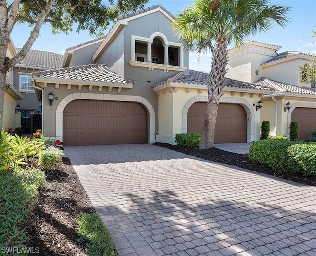 mediterranean / spanish-style house featuring a garage