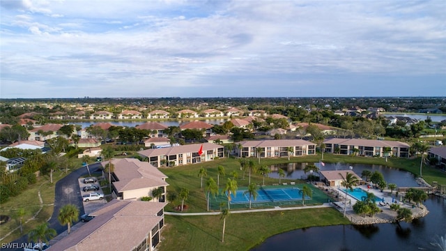 drone / aerial view with a water view