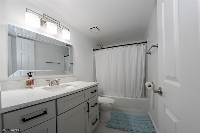 full bathroom with toilet, shower / tub combo with curtain, and vanity