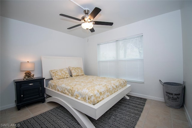 tiled bedroom with ceiling fan