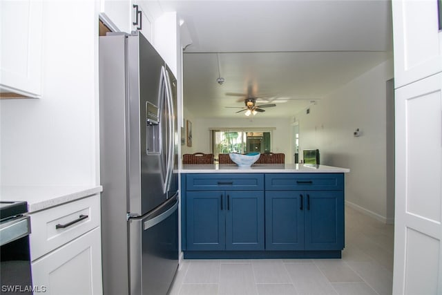 kitchen featuring light tile flooring, ceiling fan, white cabinetry, and stainless steel refrigerator with ice dispenser