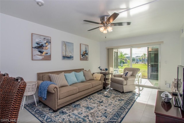 tiled living room with ceiling fan