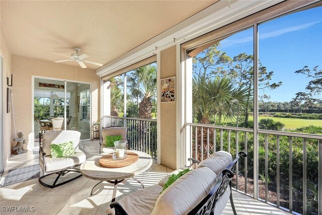 sunroom / solarium with ceiling fan