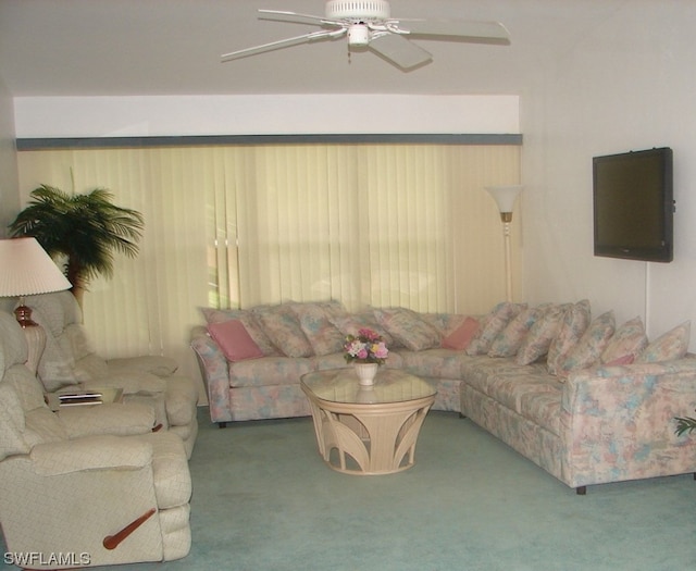 carpeted living room featuring ceiling fan