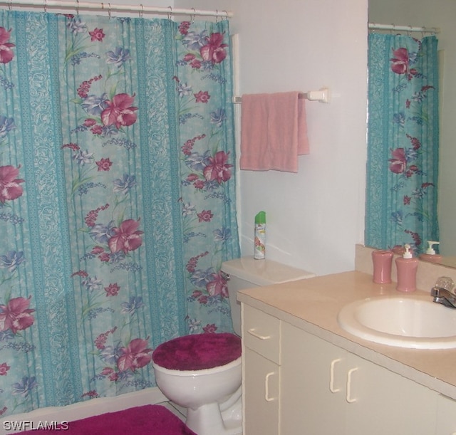 bathroom with toilet and vanity