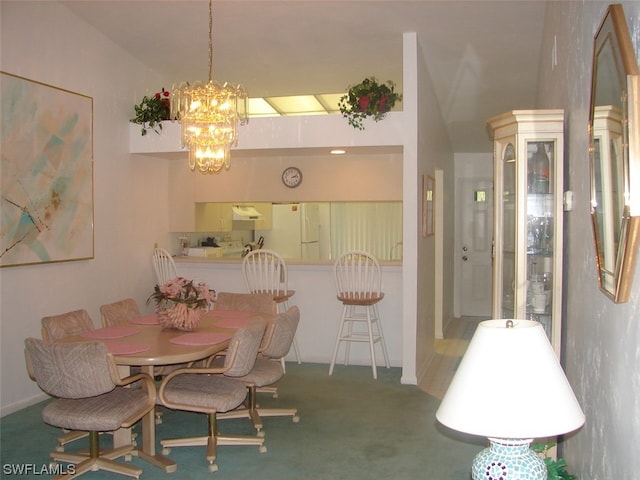 dining space featuring lofted ceiling, carpet, and a chandelier