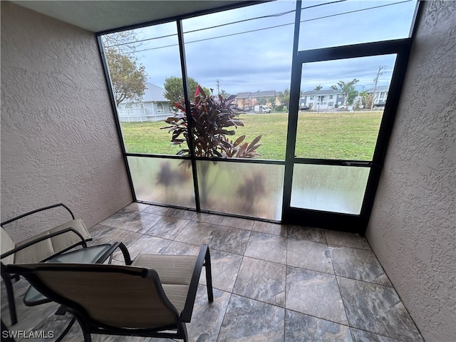 sunroom featuring a healthy amount of sunlight