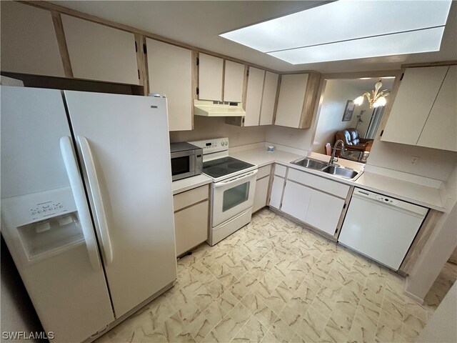 kitchen with white appliances, white cabinets, sink, and light tile floors