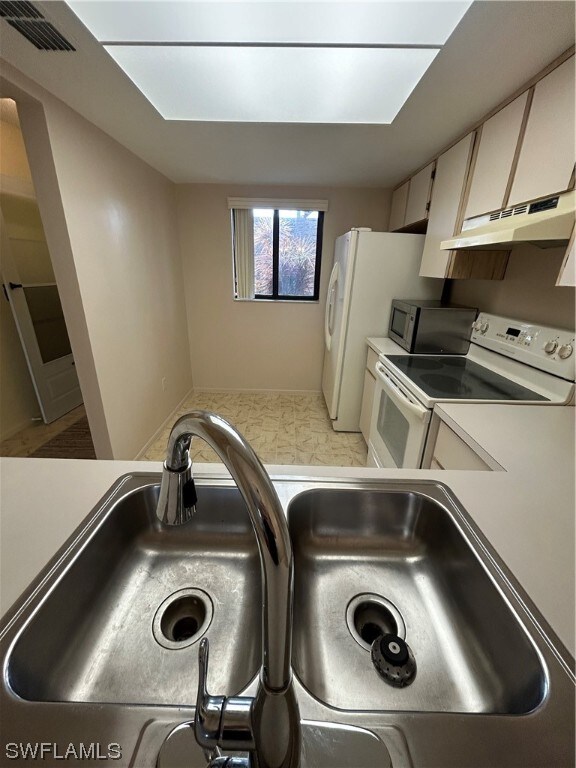 room details featuring white electric stove