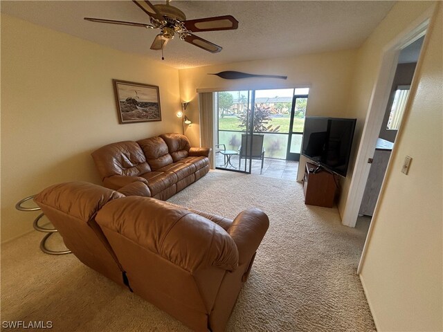 living room with light colored carpet and ceiling fan