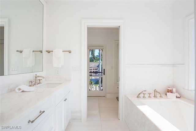 bathroom featuring a bath, vanity, and tile patterned flooring