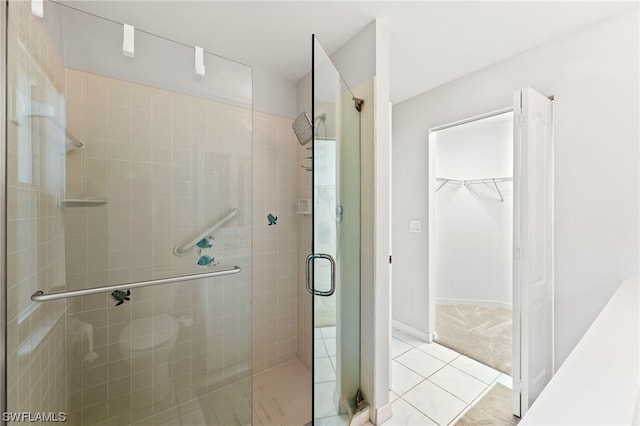 bathroom featuring tile flooring and walk in shower