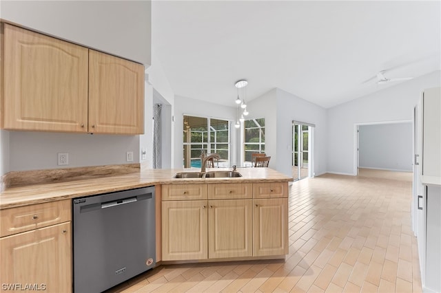 kitchen with ceiling fan, sink, stainless steel dishwasher, vaulted ceiling, and light brown cabinetry