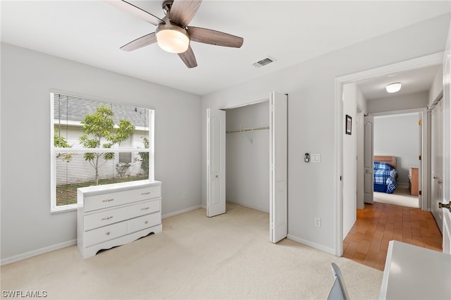 interior space featuring light hardwood / wood-style flooring, a closet, and ceiling fan