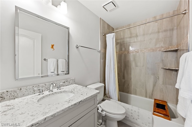 full bathroom with shower / bath combo, vanity with extensive cabinet space, and toilet