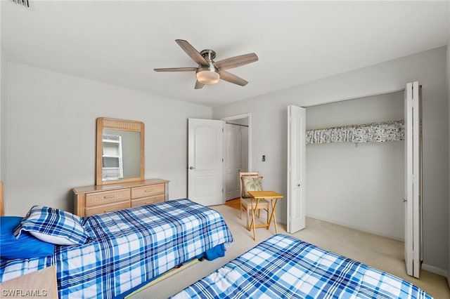 carpeted bedroom featuring ceiling fan