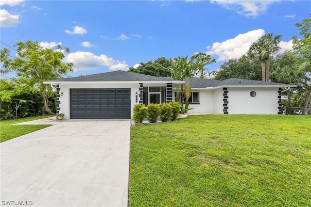 ranch-style house with a garage and a front lawn