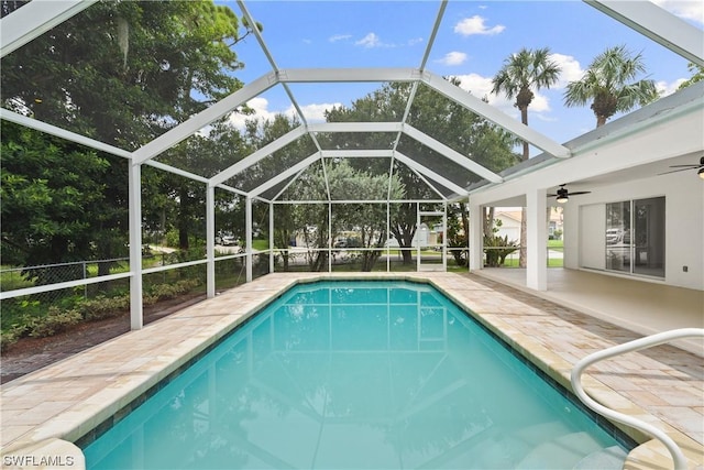 view of pool featuring a patio area, a lanai, and ceiling fan