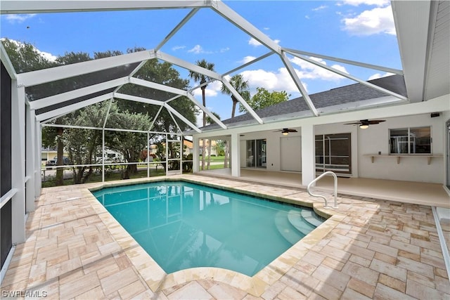 view of pool featuring ceiling fan, a lanai, and a patio