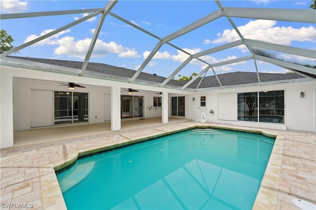 view of pool featuring a lanai, a patio, and ceiling fan