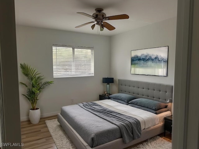 bedroom featuring light hardwood / wood-style flooring and ceiling fan