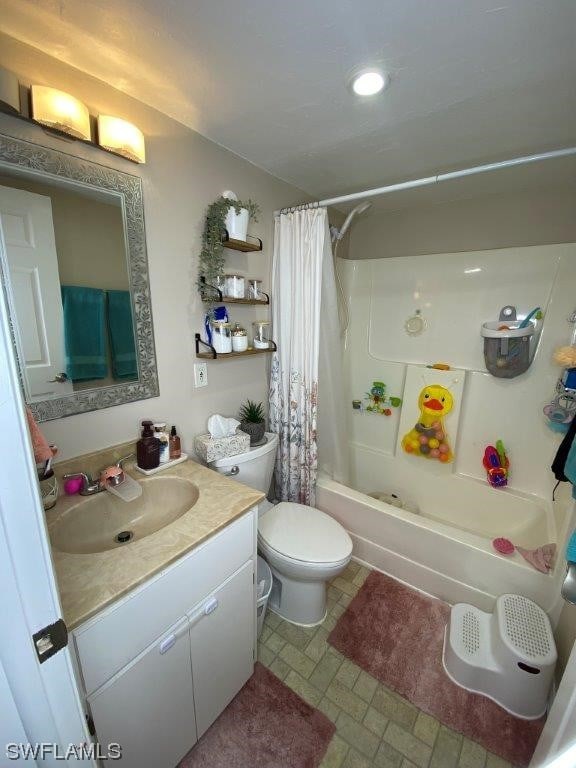 full bathroom with shower / tub combo with curtain, vanity, and toilet