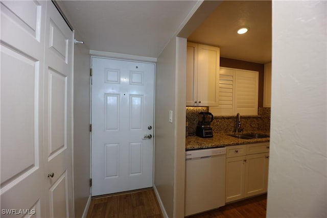 entryway with dark hardwood / wood-style flooring and sink