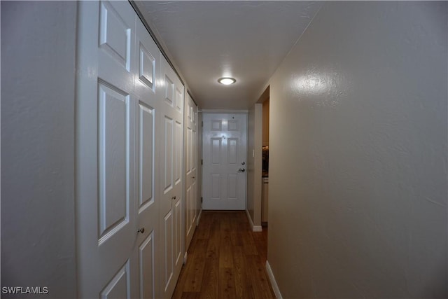 hallway featuring hardwood / wood-style flooring