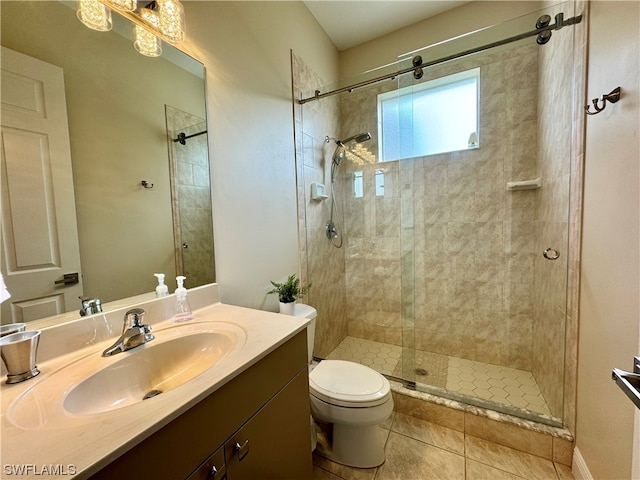 bathroom with tile floors, toilet, large vanity, and walk in shower