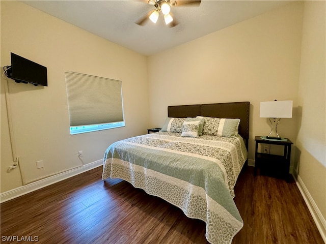 bedroom with ceiling fan and dark wood-type flooring