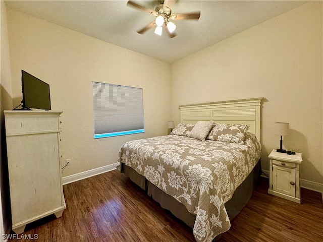 bedroom with dark hardwood / wood-style flooring and ceiling fan