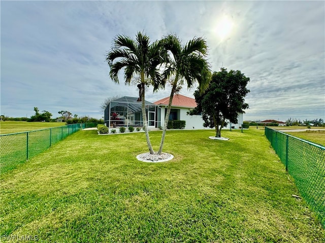 view of yard with a lanai