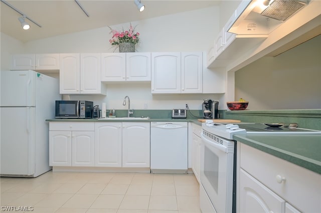 kitchen featuring white appliances, sink, track lighting, white cabinetry, and lofted ceiling