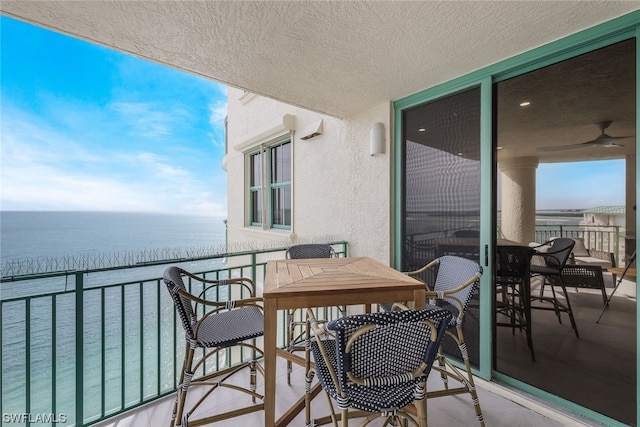 balcony featuring a water view