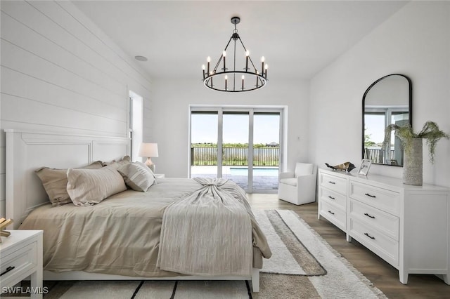 42231 Lake Timber Dr, Punta Gorda, FL 33982 - bedroom with access to outside, a chandelier, and wood finished floors