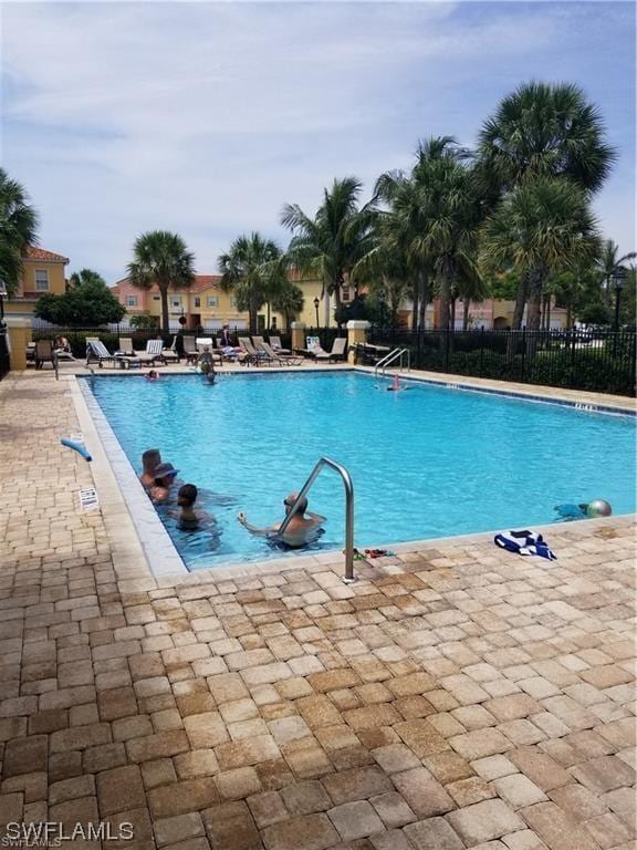 view of swimming pool with a patio