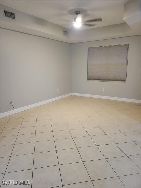 spare room featuring light tile patterned floors