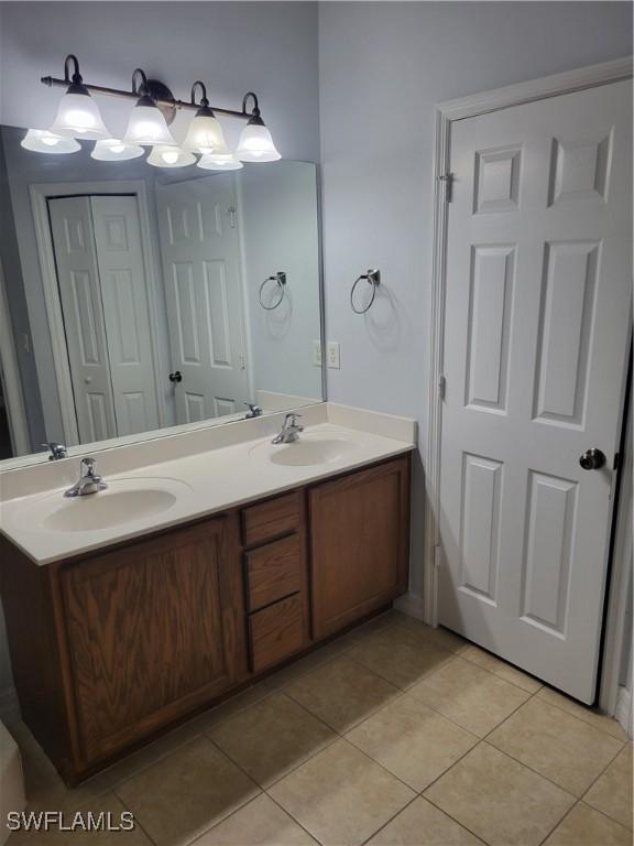 bathroom with vanity and tile patterned floors