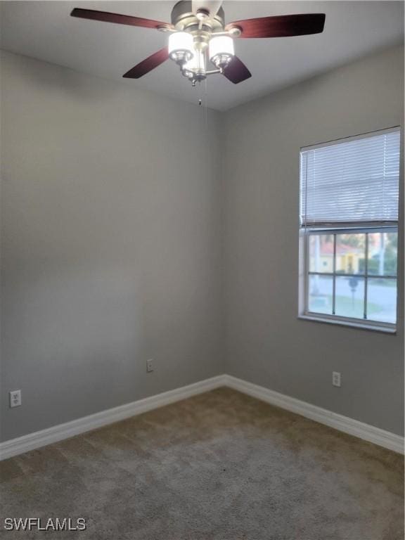 carpeted empty room with ceiling fan