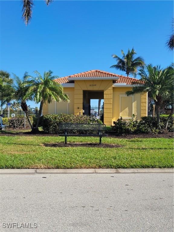 mediterranean / spanish home featuring a front yard