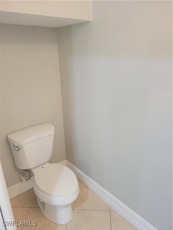 bathroom featuring tile patterned flooring and toilet