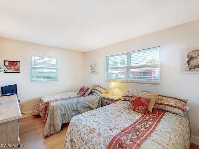 bedroom with light hardwood / wood-style flooring