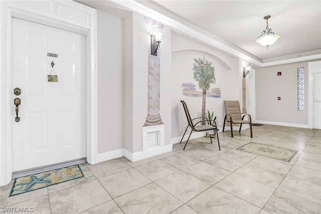 entrance foyer featuring light tile patterned floors and baseboards