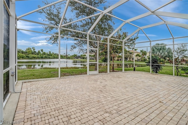 unfurnished sunroom with a water view