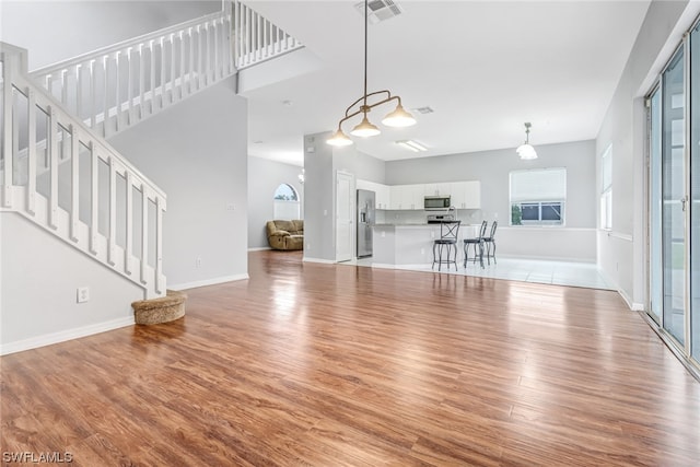 unfurnished living room featuring light hardwood / wood-style floors